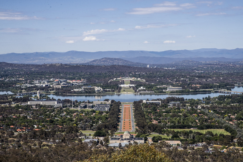 An image of Canberra including Lake Burley Griffin and Parliament House from a high vantage point on Mt Ainslie